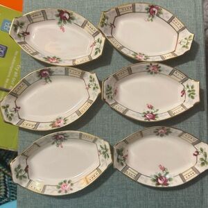 White and Green Porcelain Serveware likely salt 
Servers